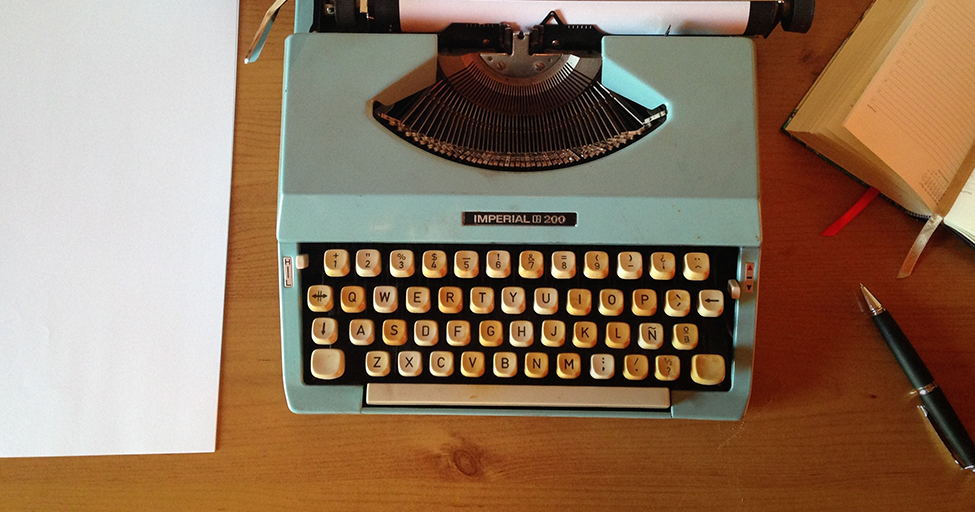 blue typewriter on desk
