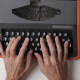 hands on a typewriter