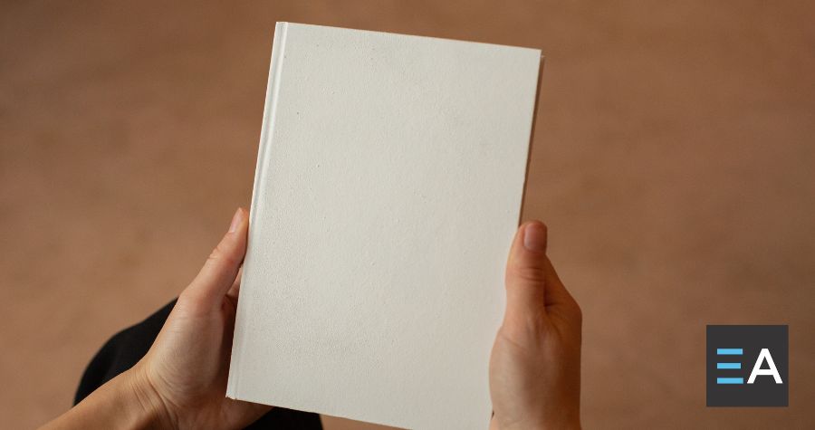 A person holding a blank book