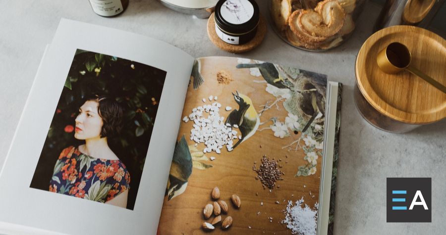 An open cookbook surrounded by spice jars