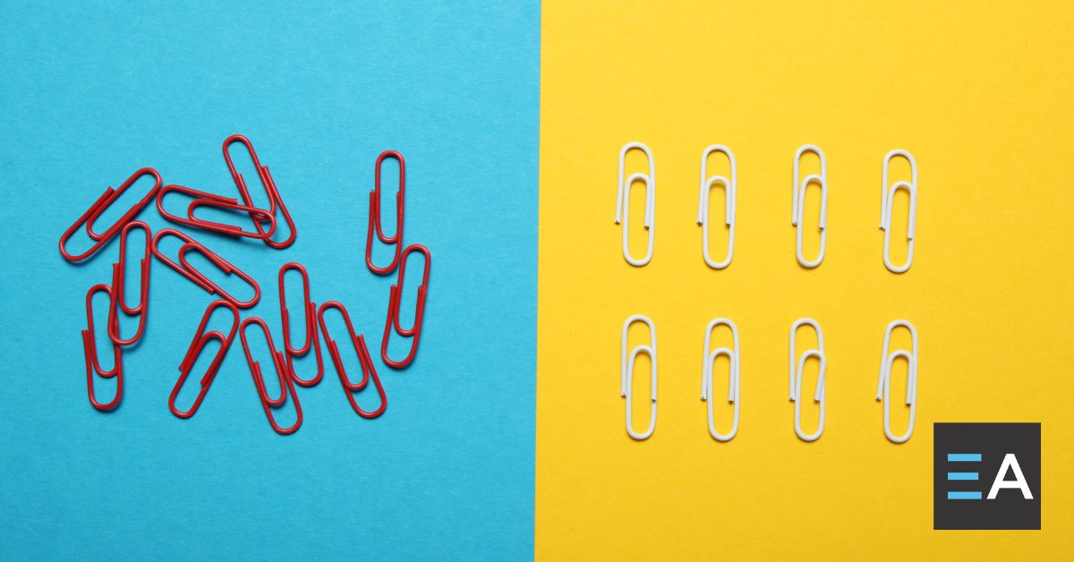 Two groups of paperclips. On the left, red paperclips are unorganized in a pile, on the right they are nearly arranged
