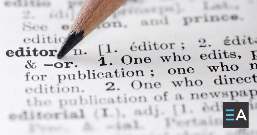 A pencil marking the dictionary entry for the word editor