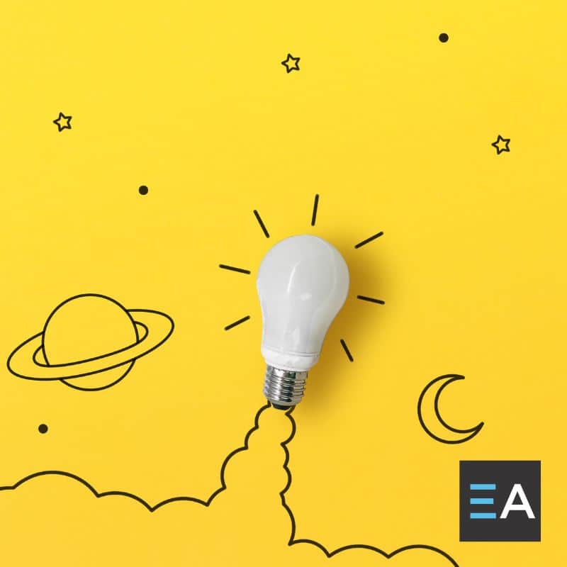 A lightbulb with drawings of rocket and space imagery drawn around it on a yellow background