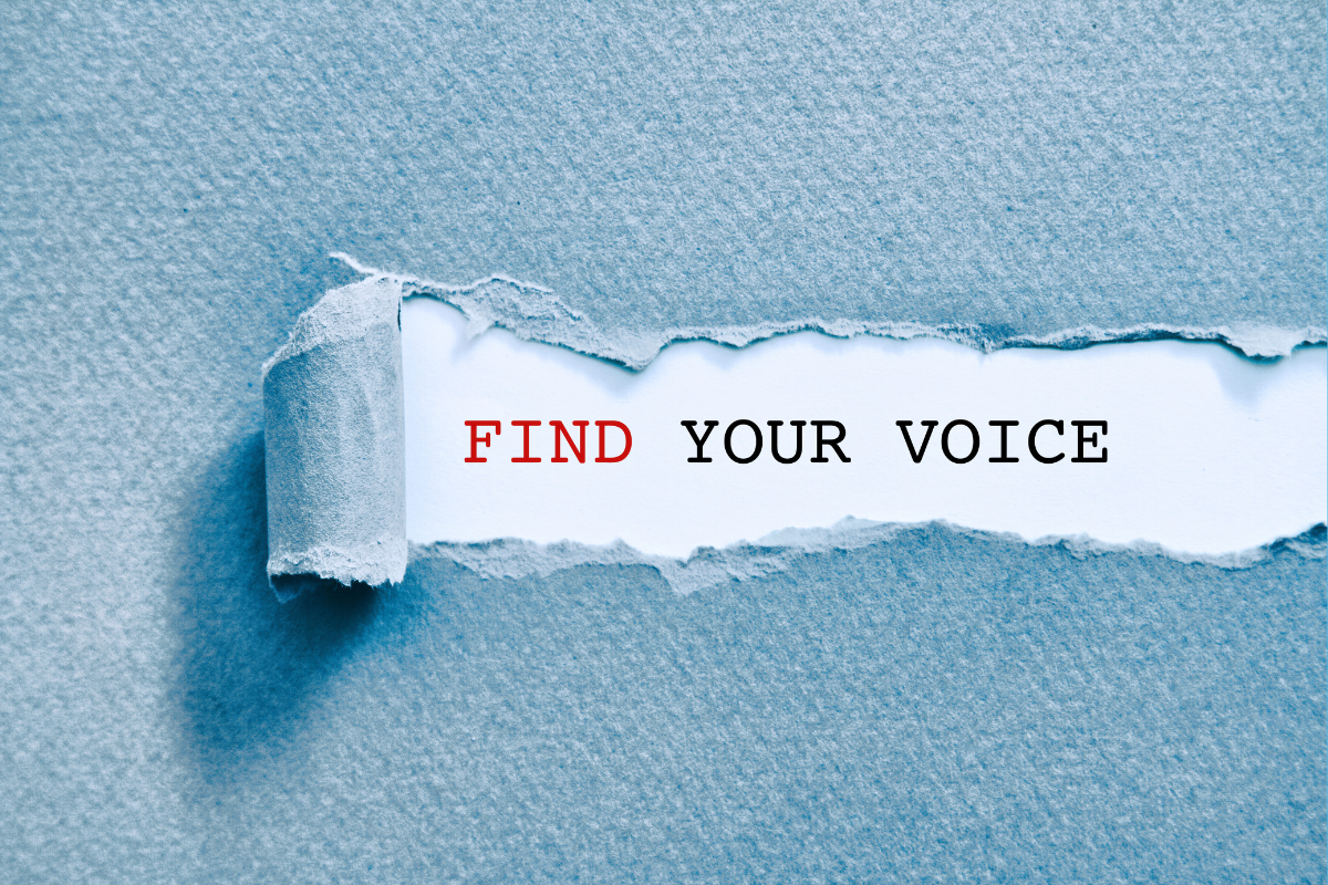 Textured paper is torn back to reveal the words "find your voice"