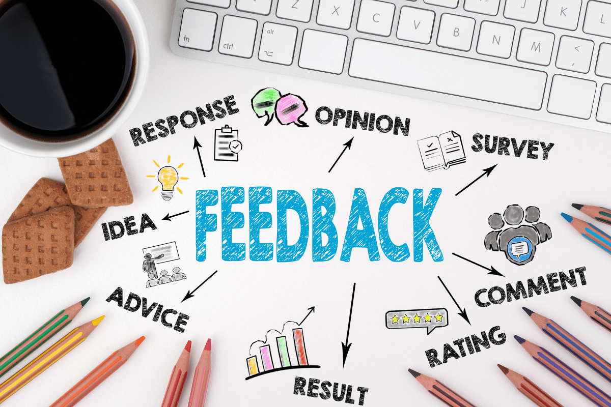 The word "feedback" surrounded by graphic icons near a keyboard