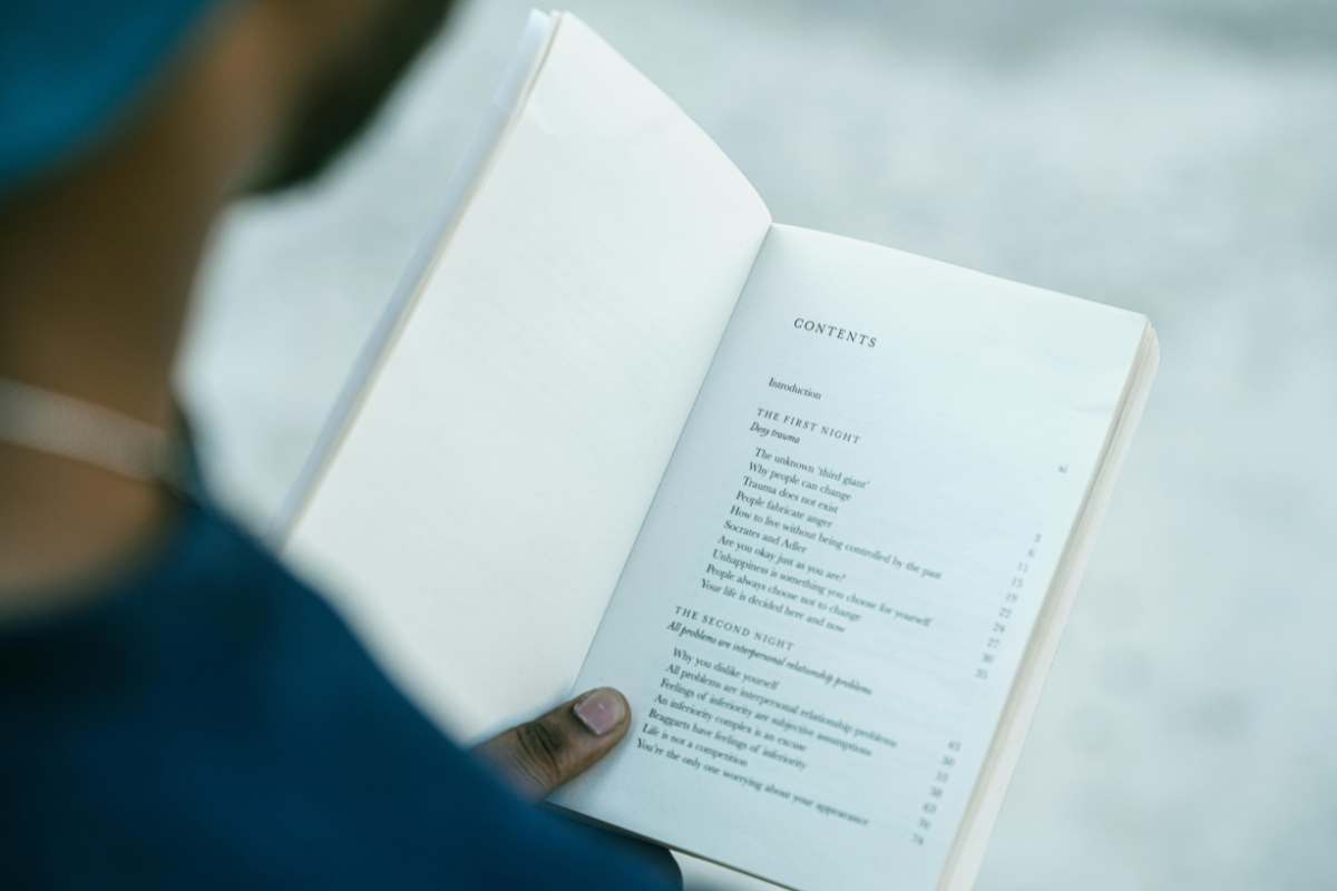 A person looks at a table of contents