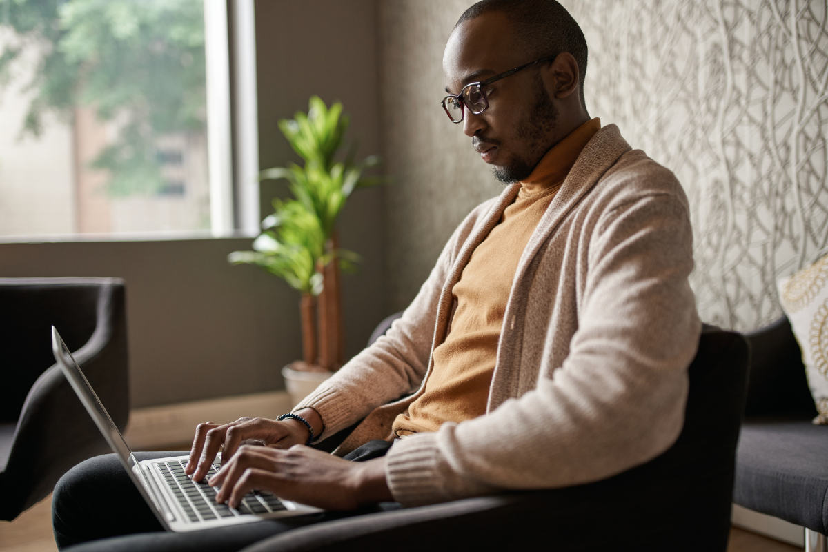 A business author typing on a laptop