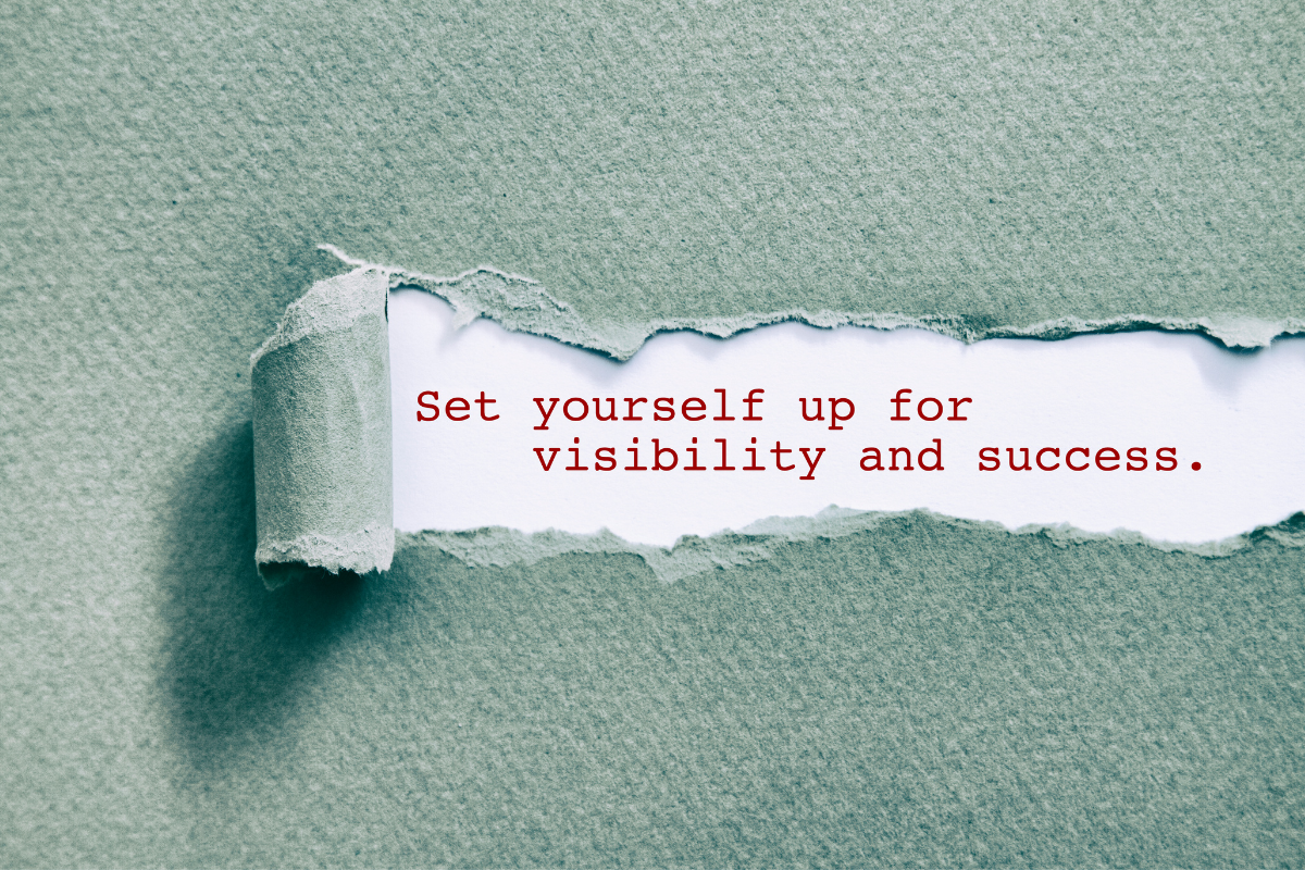 The words "set yourself up for visibility and success" are revealed behind a torn back gray foreground
