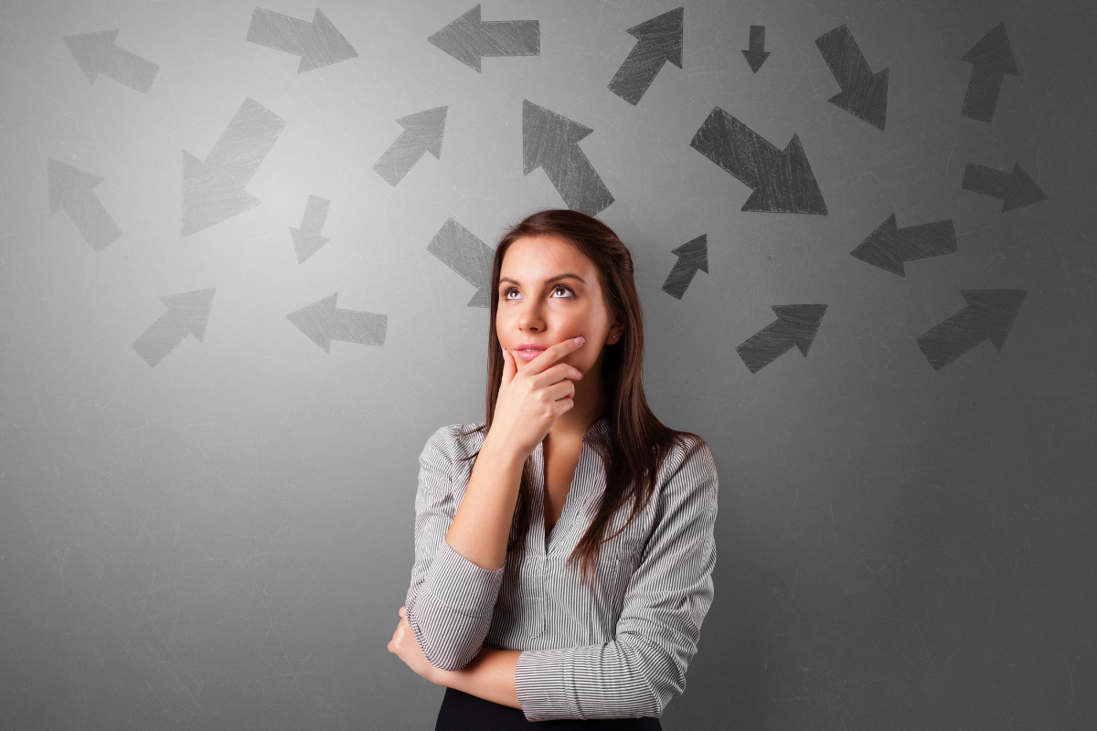 An author makes a decision as arrows point in different directions above their head