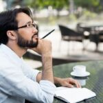 A writer in a park thinks of a business book idea