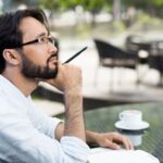 A writer in a park thinks of a business book idea