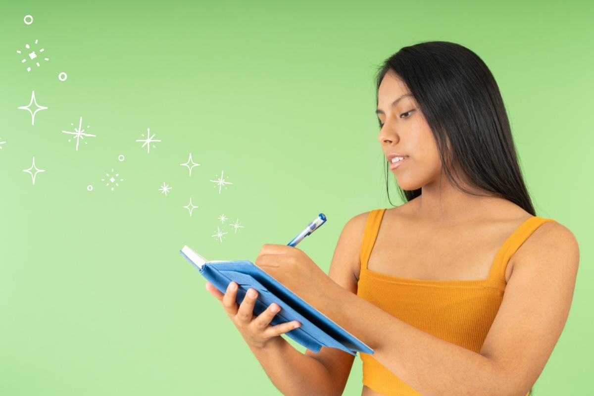 An author writes an autobiography in a notebook