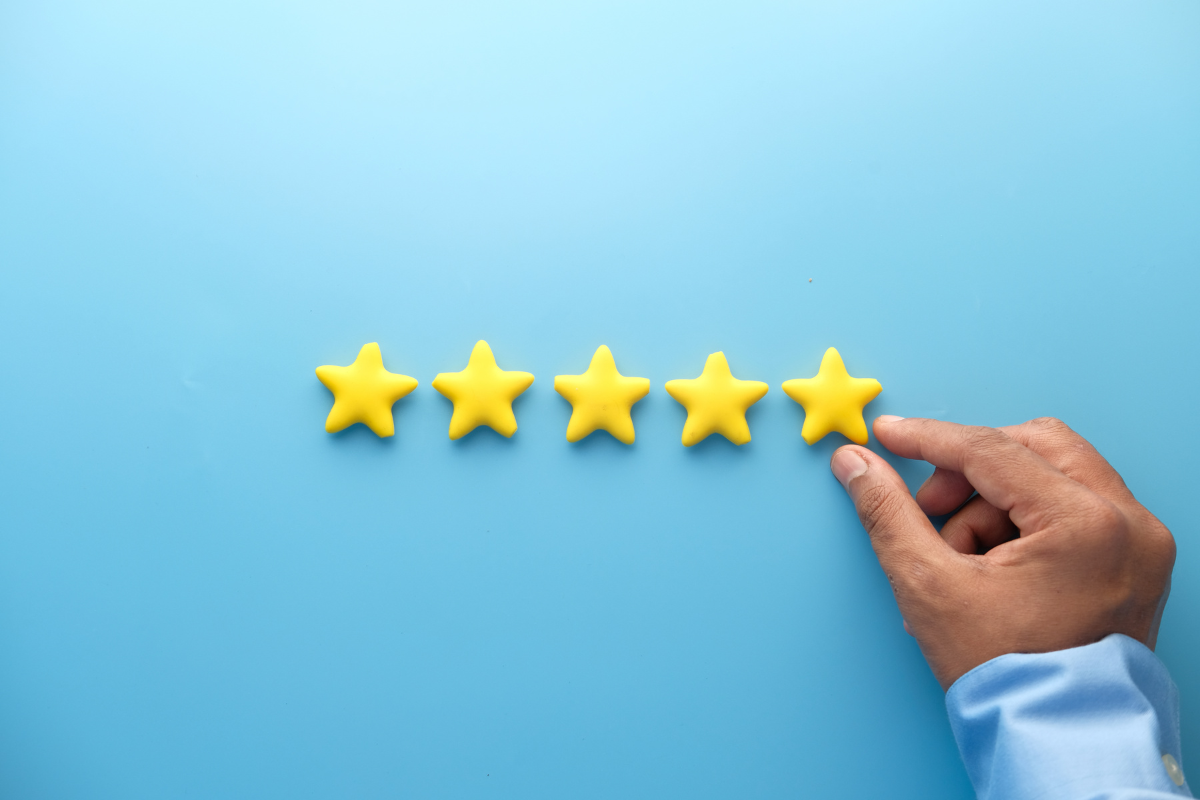 A person lining up five stars in a row