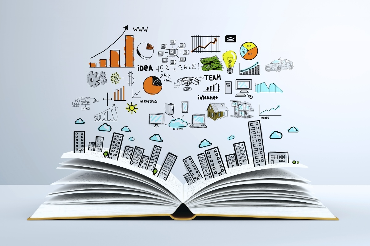 An open book with cartoon skyscrapers growing from its pages and business graphics above