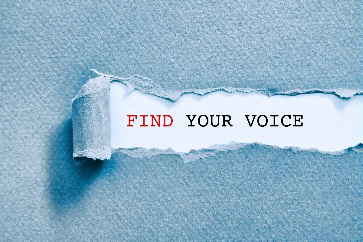 Textured paper is torn back to reveal the words "find your voice"