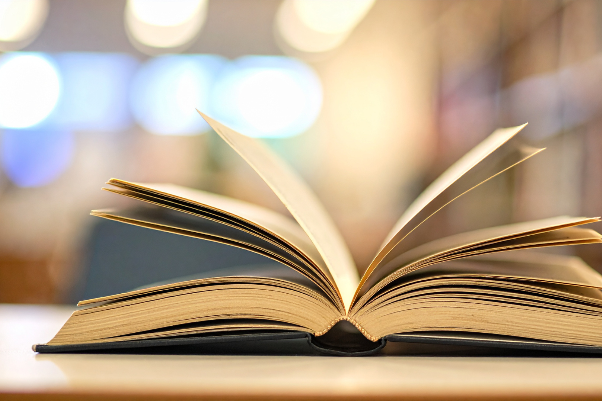 An open book on a table with its pages spread out