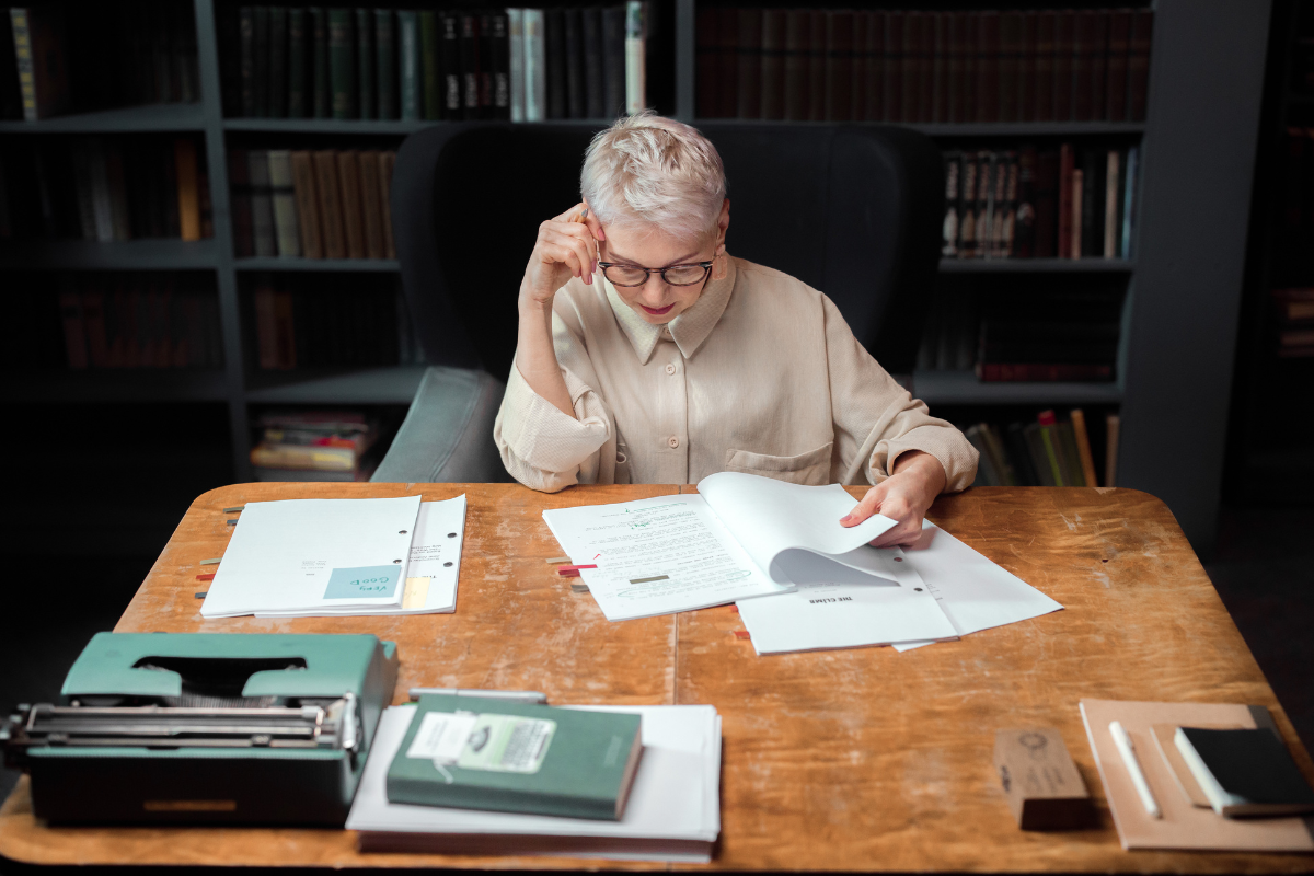 A professional editor examines a manuscript