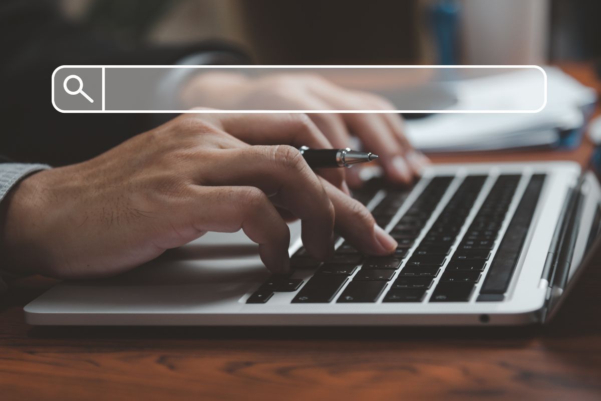 A writer uses a laptop to implement a book marketing strategy online