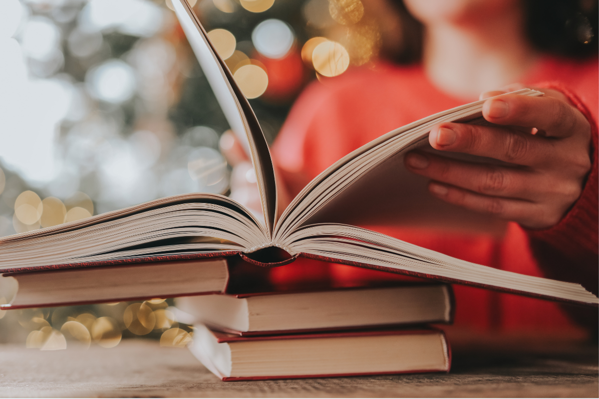 A person pages through a book