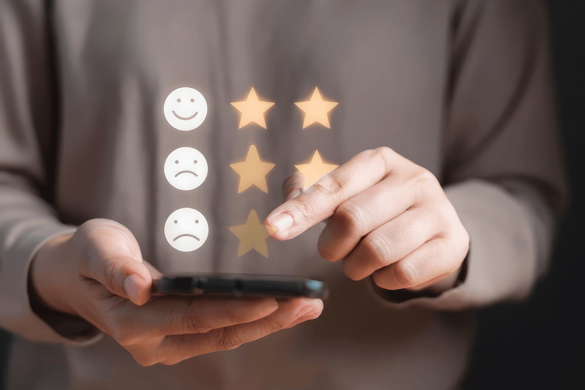 A person leaves a review on their phone