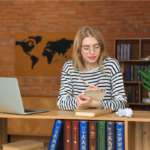 Business author reviewing a published book at a desk