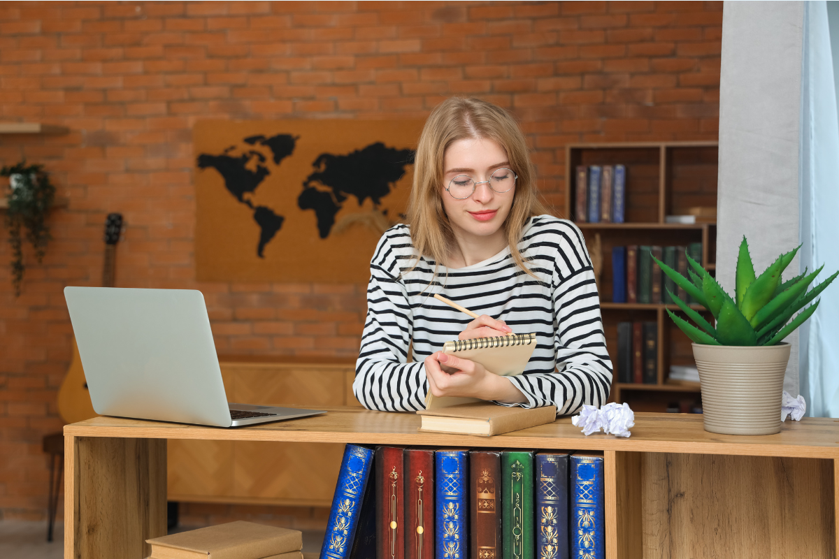 Business author reviewing a published book at a desk