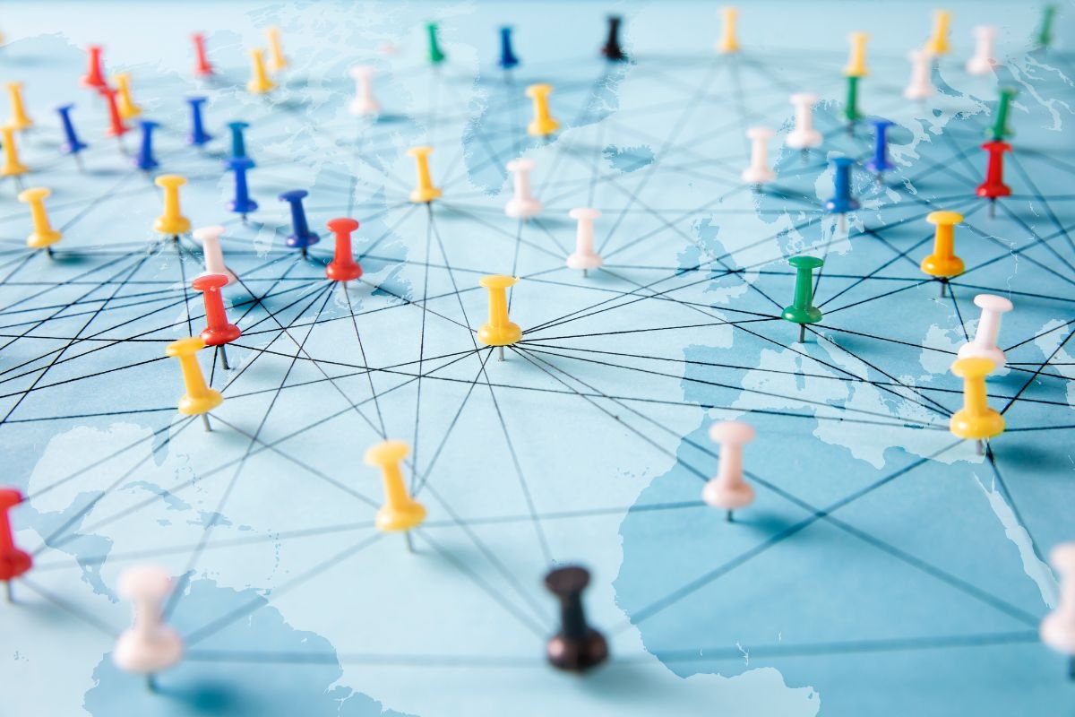 Pins connected by black lines on a map of the Earth