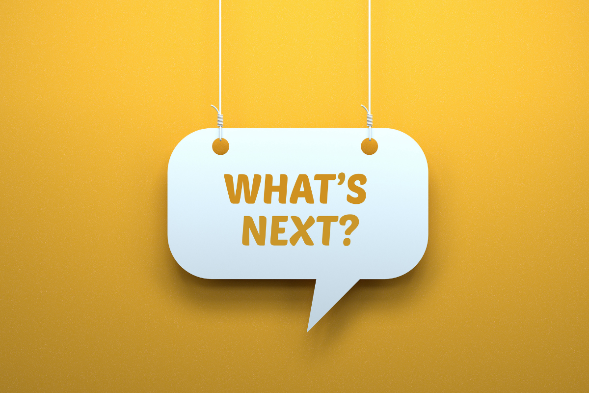 A comment bubble suspended on wires that says "what's next?"