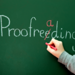 A person correcting a misspelling of proofreading on a chalkboard