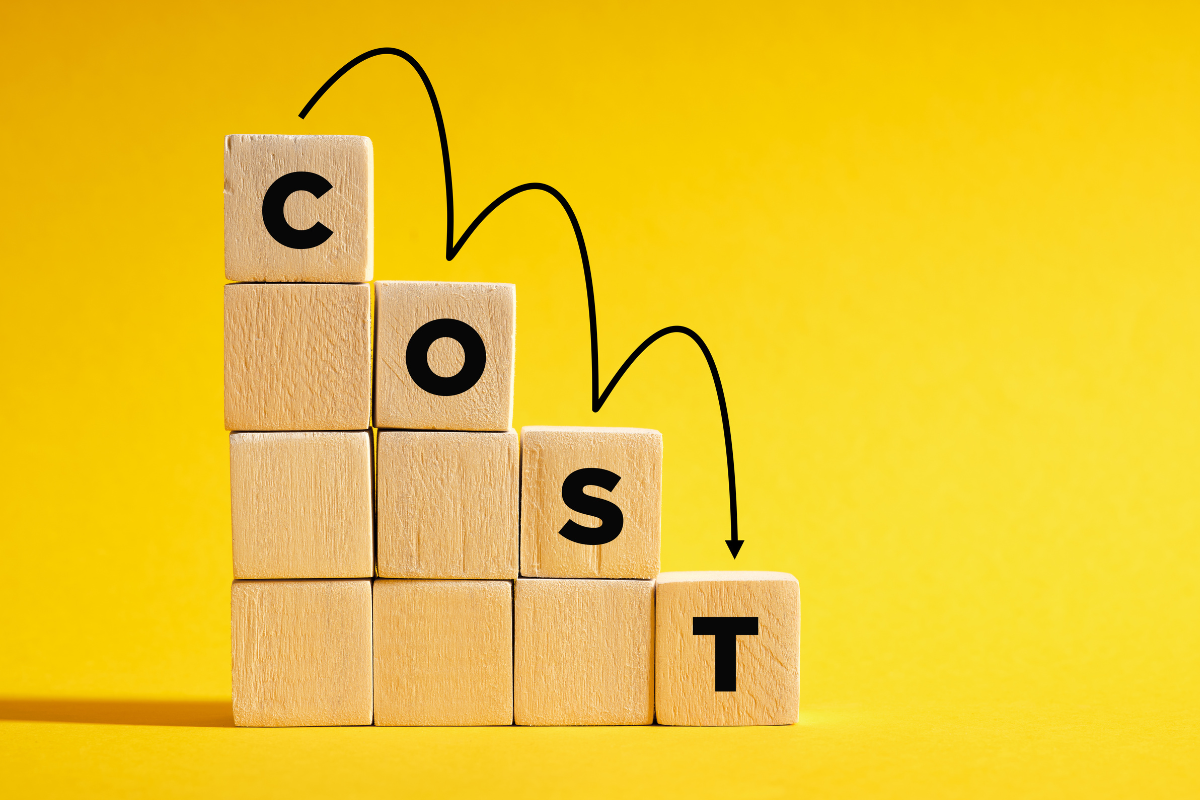 The word "cost" spelled on a tower of descending blocks
