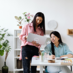An author receives feedback in a bright office setting
