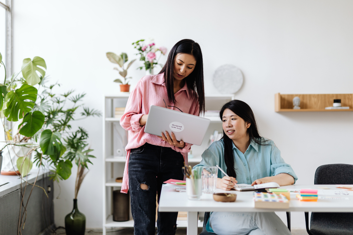 An author receives feedback in a bright office setting