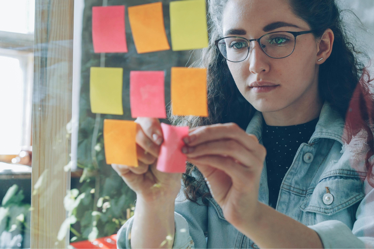 Writer organizing interview notes into a book outline
